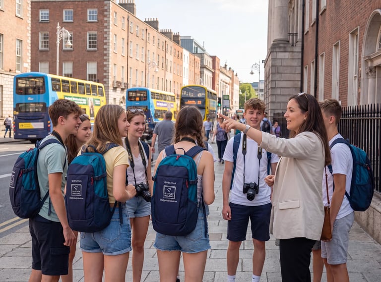 Adult tour guide with clipboard speaking to a group of students wearing blue backpacks on a Dublin street